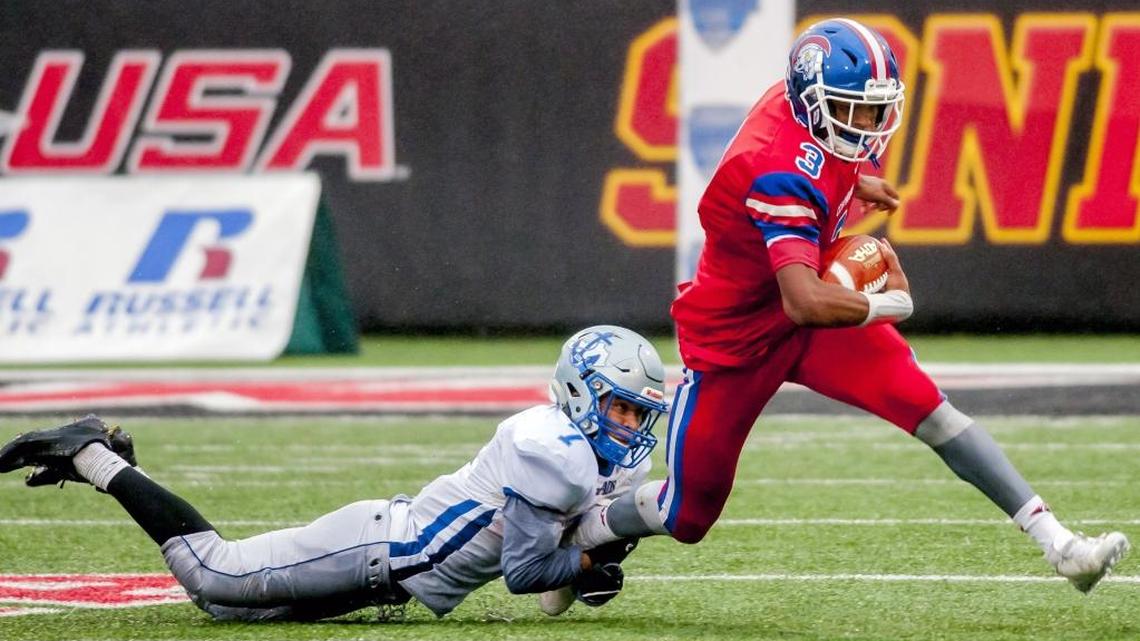 Louisville Christian’s Milton Wright (3) drags Danville’s Dmauriae VanCleave (7) during the KHSAA Class 2A state championship in Bowling Green, Ky., Sunday, Dec. 4, 2016.