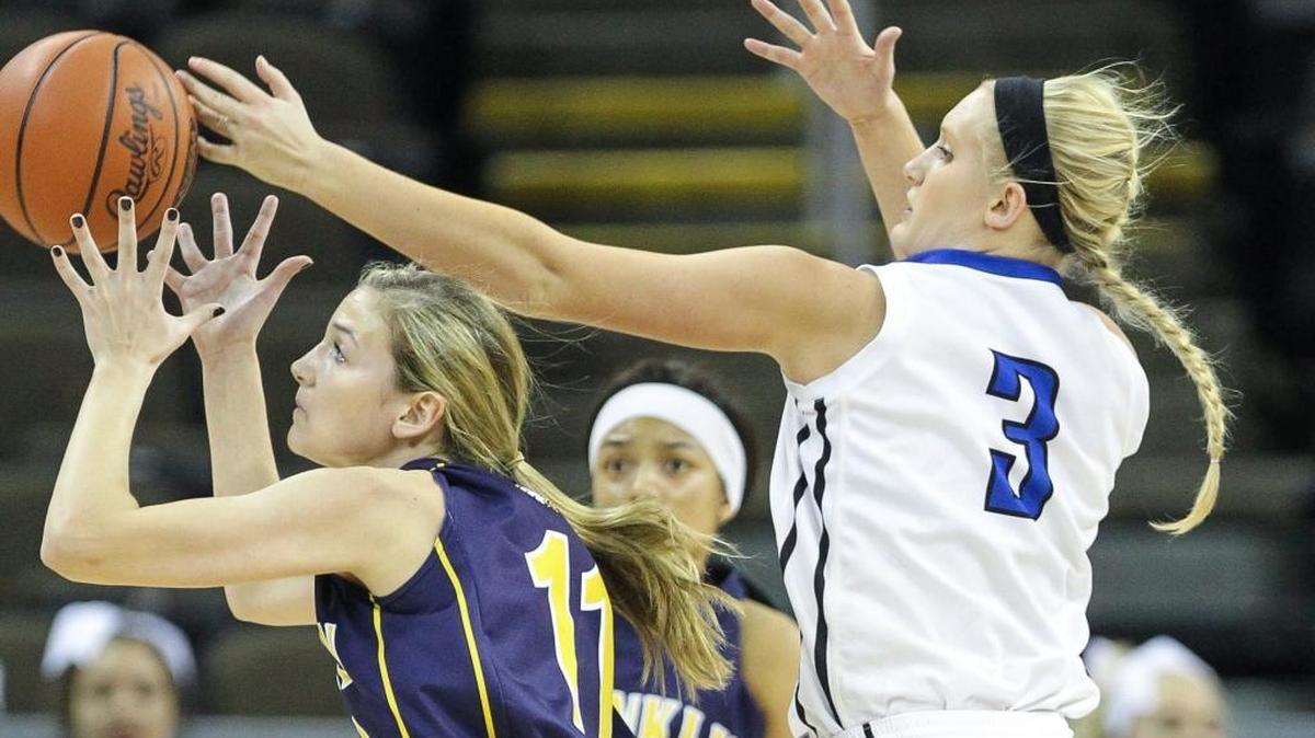 Franklin County's Rebecca Cook attempts to control the ball as Shelby Valley's Lakyn Mullins reaches to knock it away during their first round game in the 2016 St. Elizabeth Healthcare/KHSAA Girls' Sweet 16 State Tournament, Wednesday, March 9, 2016.