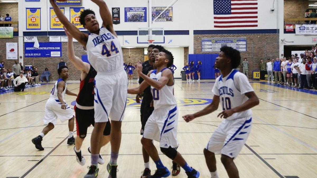 Henry Clay’s Jordan Houston (44) pulled down a fourth-quarter rebound against Paul Dunbar on Feb. 10 in Lexington.