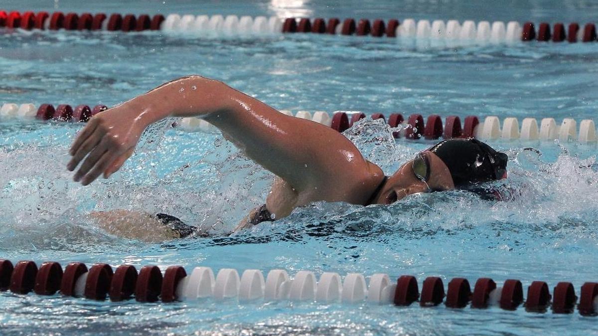Paul Laurence Dunbar's Lauren Denham, who has committed to swim at UK, pulled away to win the girls’ 200 freestyle at the Lexington City Swim Meet.