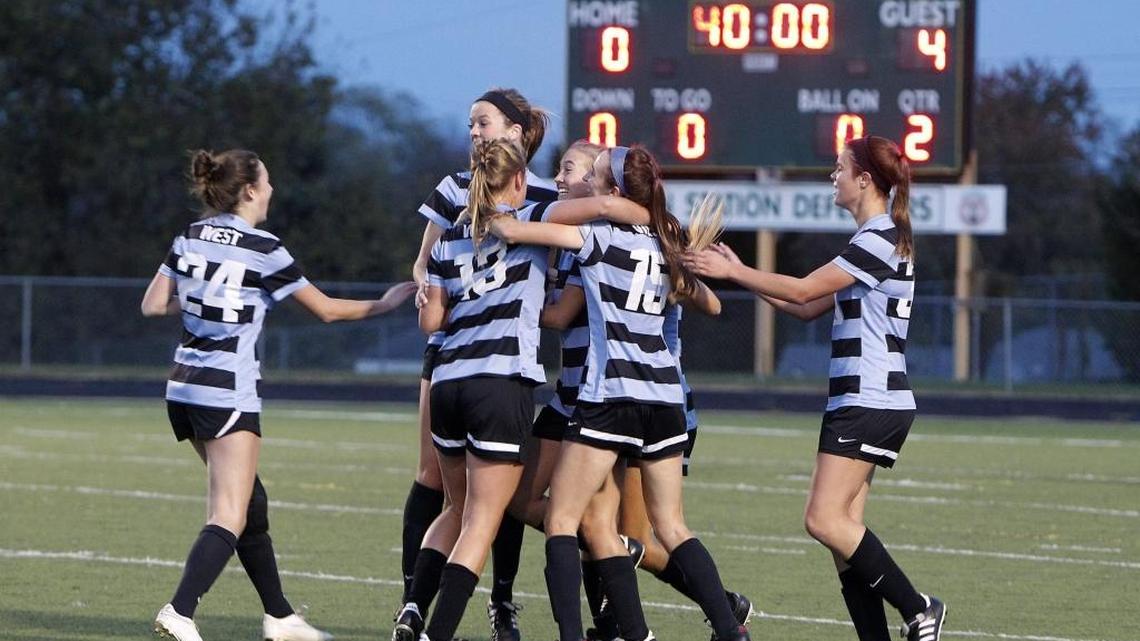 West Jessamine players celebrate the 4-0 win against Lexington Catholic to win the KHSAA girls' state soccer championship at R. L. Grider Stadium in Lexington, Ky., Saturday, November 5, 2016. DeAngelo Wiser, now an assistant women’s coach at Asbury, was the program’s first head coach.