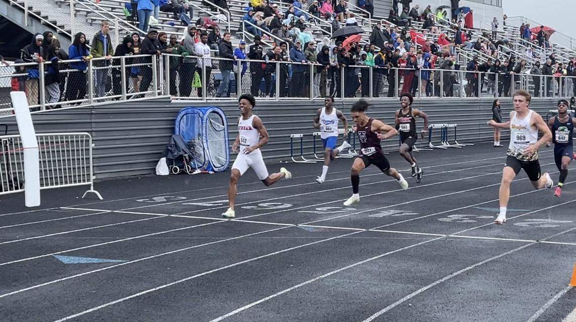 Paul Laurence Dunbar’s Kaylib Nelson crosses the finish line first in the 100 meters Saturday. Nelson also won the 200 and anchored the Bulldogs’ victory in the 4-by-100 relay.