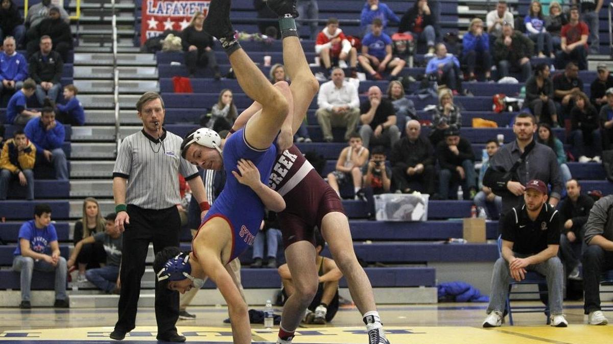 Tates Creek's Brady Gibson wrestles Lafayette's Noah Rhode to win the finals of the 160-pound class at the city wrestling championships in the Al Prewitt Gymnasium at Henry Clay in Lexington, Ky., Saturday, February 4, 2017.