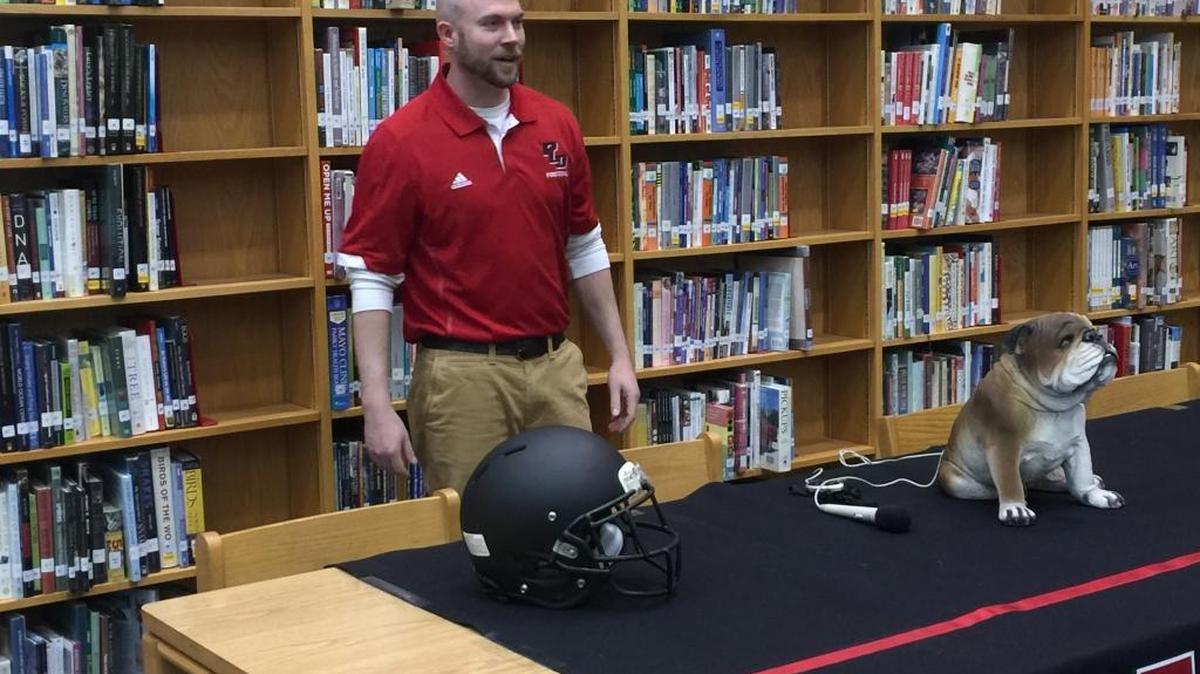 Chris Mullins was introduced as the new football coach at Paul Laurence Dunbar High School on Monday, Feb. 29, 2016.