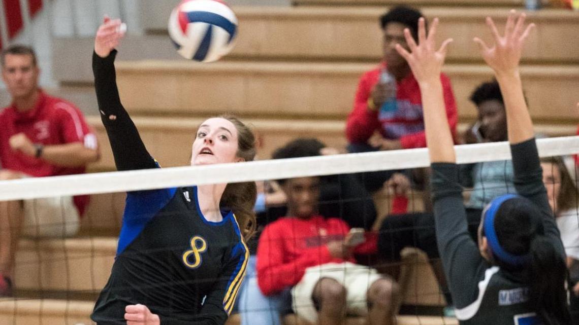 Henry Clay's Hallie Shelton (8) hit as Henry Clay swept host Madison Central in the 11th Region semifinals on Wednesday Oct. 26, 2016 in Richmond, Ky.