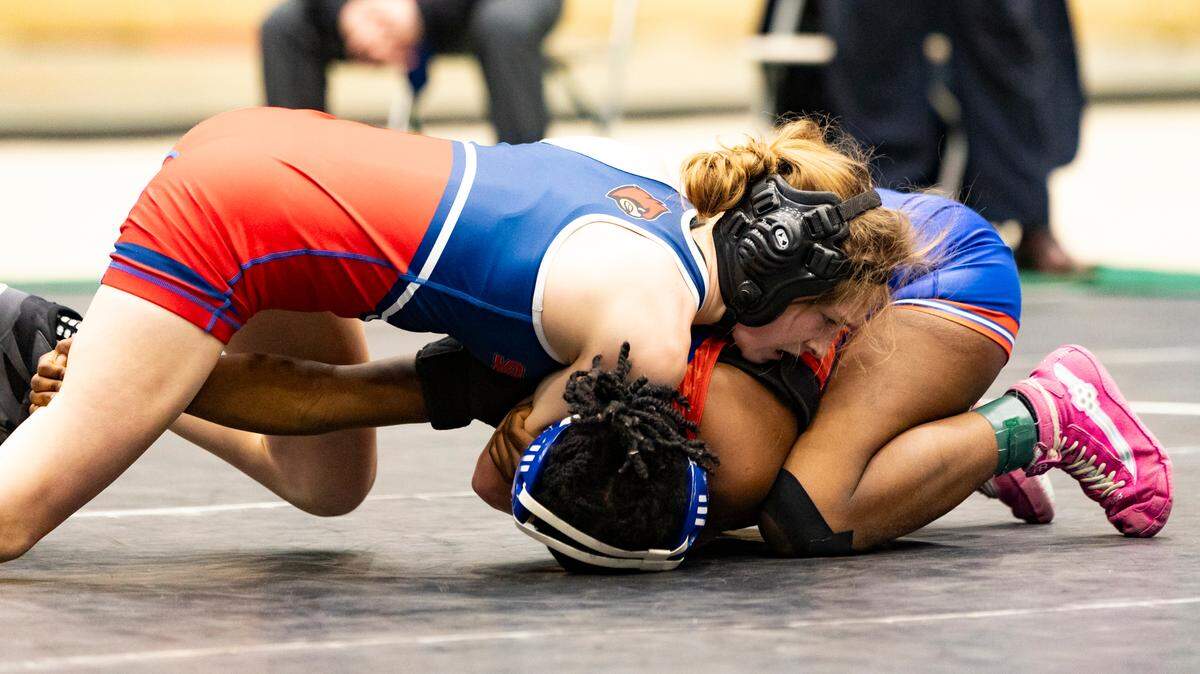 Scott County’s Ava Castleman tries to control Lafayette’s Jeanette Asukulu in the 107 finals of the 2025 KHSAA Girls State Wrestling Championships at Alltech Arena on Thursday.