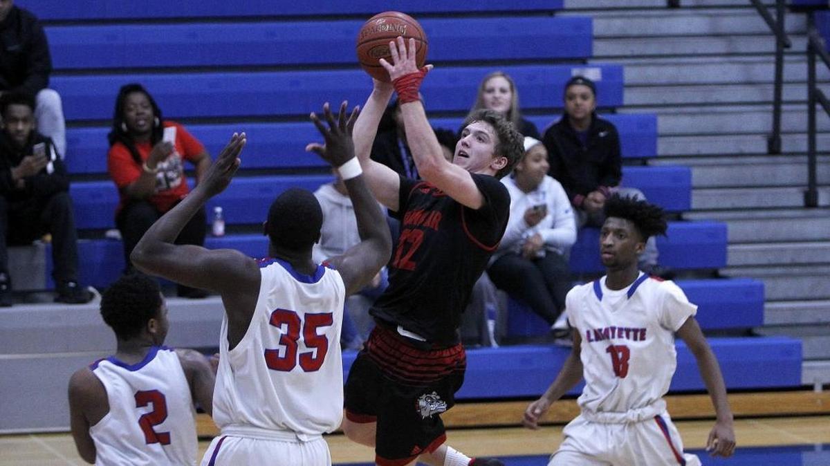 Paul Laurence Dunbar’s Jared Gadd (black jersey) scored 24 points Friday night in the Bulldogs’ 91-84 upset of top-ranked Scott County.