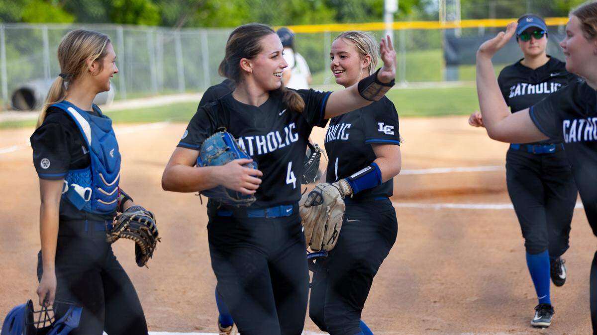 Lexington Catholic’s Abby Hammond high-fives a teammate as the Knights close out an inning at Bryan Station during a 2-0 win on April 4. Hammond was named 2025’s Miss Softball by the Kentucky Softball Coaches Association.