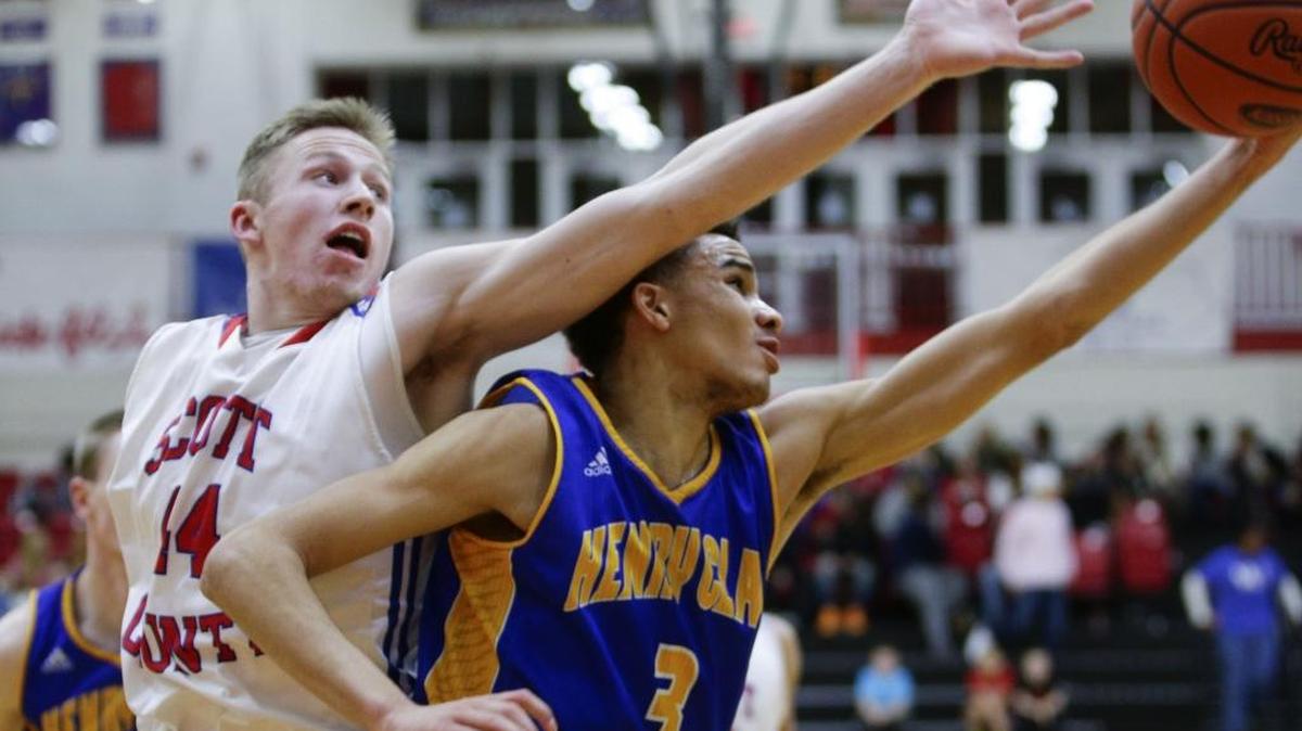 Henry Clay’s Leander Ridgeway (3) battled for a rebound with Scott County’s Cooper Watts on Feb. 5 in Georgetown.