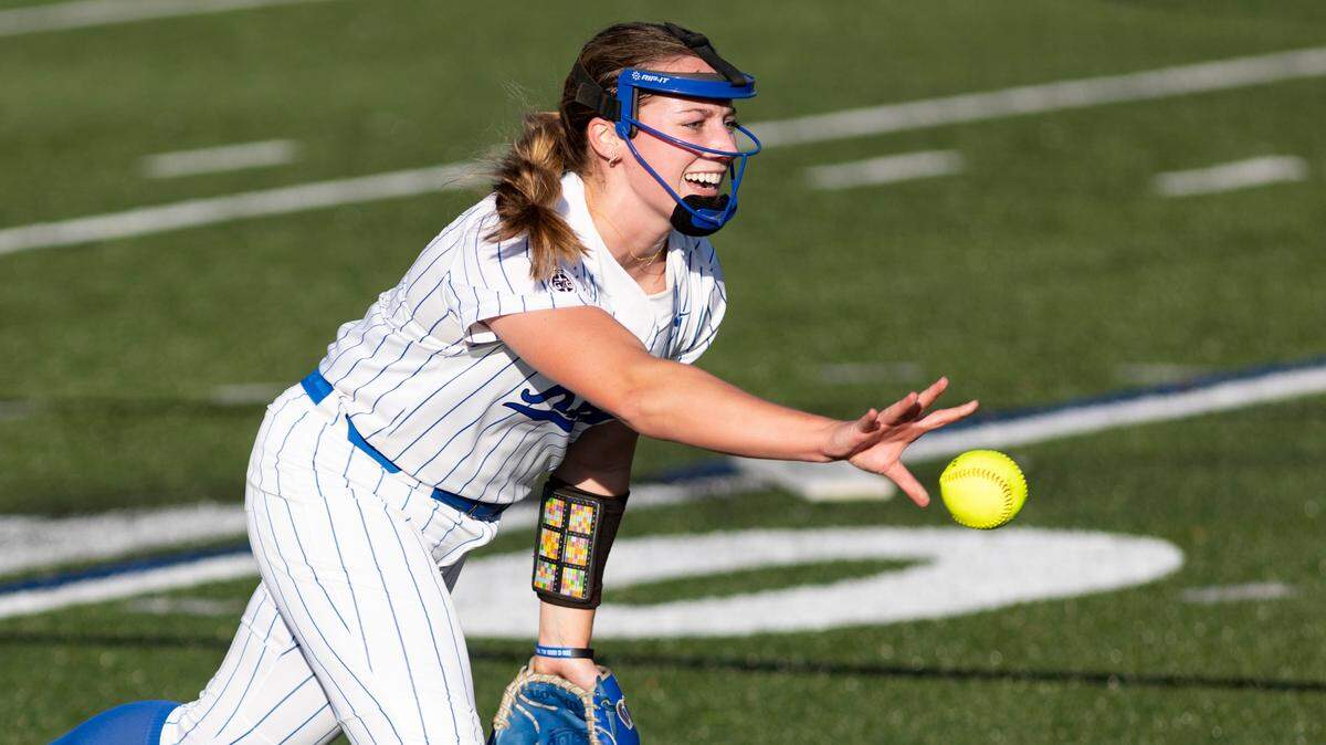 Lexington Catholic’s Abby Hammond tosses to first base for an out during the Knights’ 2-1 win over Lafayette at Lexington Catholic High School on Monday.