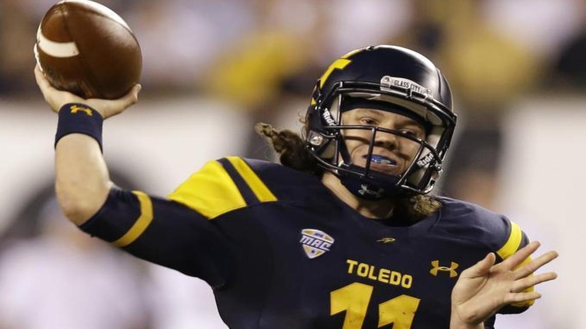 Toledo quarterback Logan Woodside passes against Cincinnati in the second half of an NCAA college football game, Friday, Sept. 12, 2014, in Cincinnati.