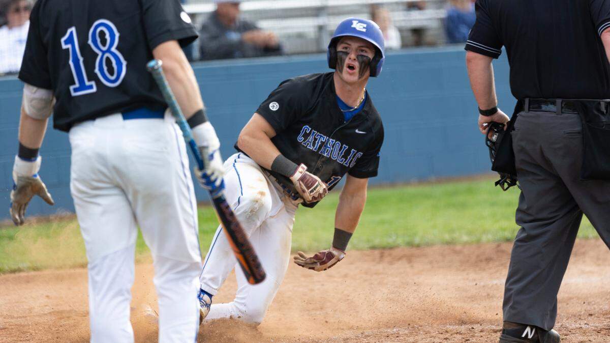 Lexington Catholic’s Cody Decker slides into home after a sacrifice fly by Josh Crandall during the Knights’ 2-1 win over Lexington Christian in the 43rd District Tournament championship game at Lafayette on Wednesday.