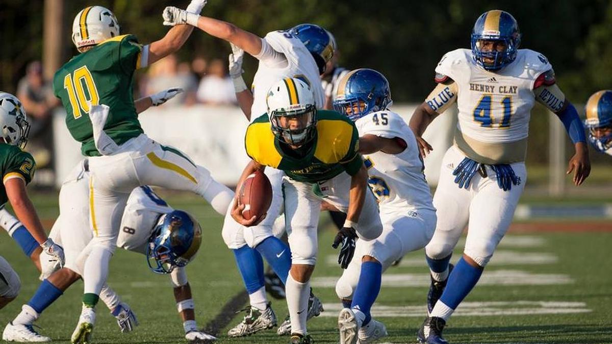 St. X quarterback Desmond Ridder broke through the Henry Clay line in the second quarter on Aug. 28, 2015. Ridder rushed for 151 yards on 12 carries and he added 122 passing yards and a touchdown throw.