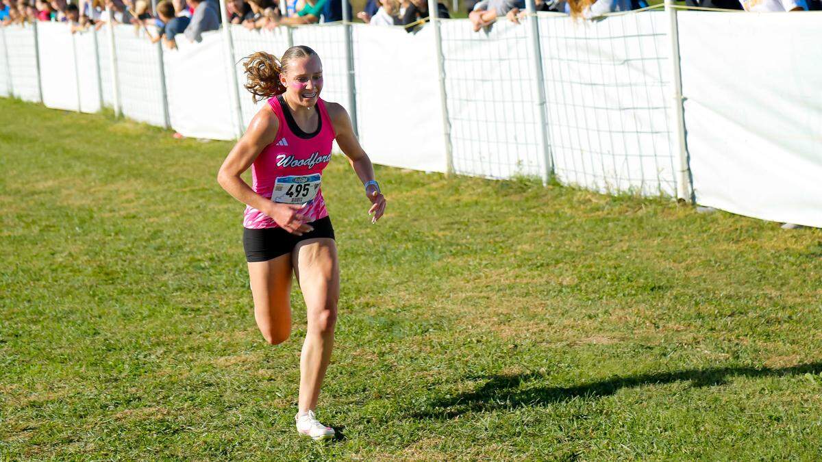 Woodford County’s Addison Moore set the course record at Bourbon County Park in Paris as she won the girls Class 3A Region 6 Cross Country Championship on Saturday.