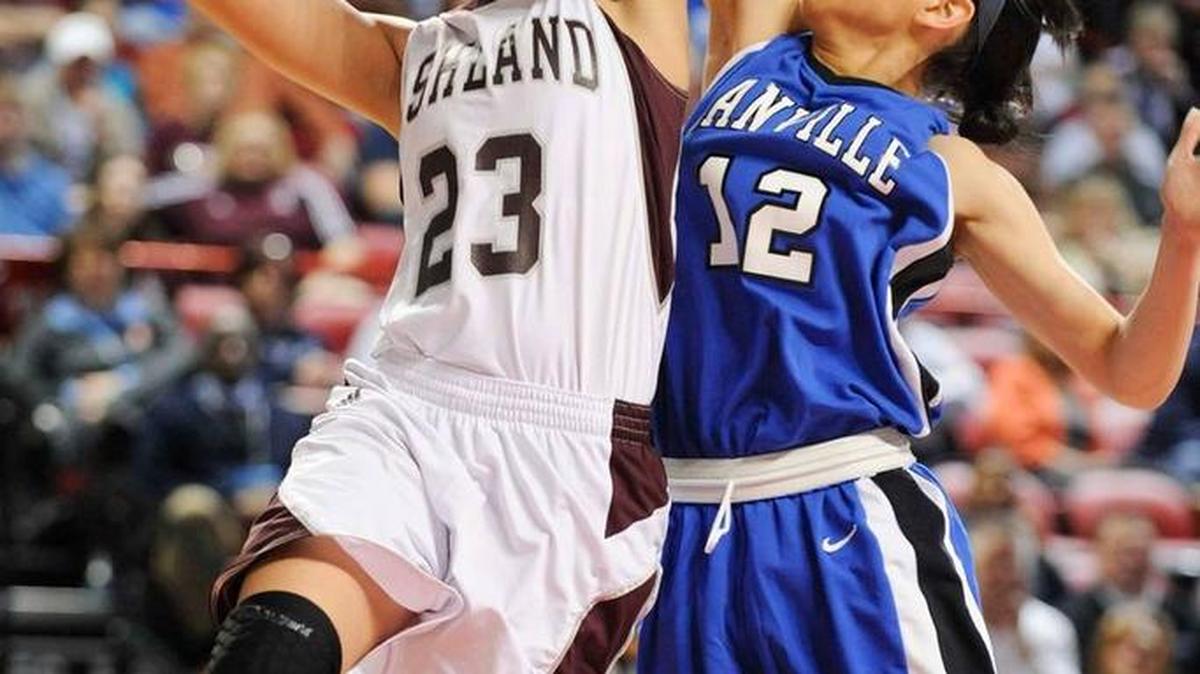 Ashland Blazer’s Mykasa Robinson (23) shoots past Danville's Cameron McPherson (12) during their quarterfinal game in the Houchens Industries/KHSAA Girls' Sweet 16 at E.A. Diddle Arena in Bowling Green, Ky., Friday March, 14, 2014.