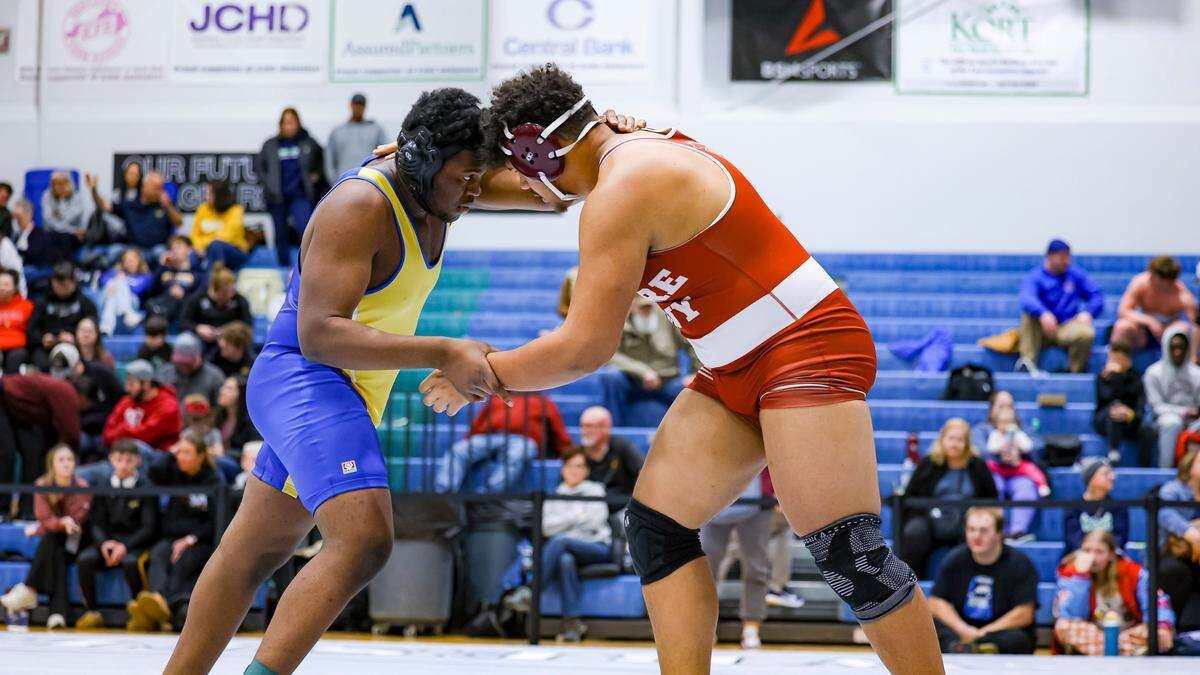 Henry Clay’s Jean Louis Mokweke grapples with Tates Creek’s Miles Hayward during the 285 division finals at the Boys/Coed Region 6 Wrestling Championships at East Jessamine High School on Saturday.