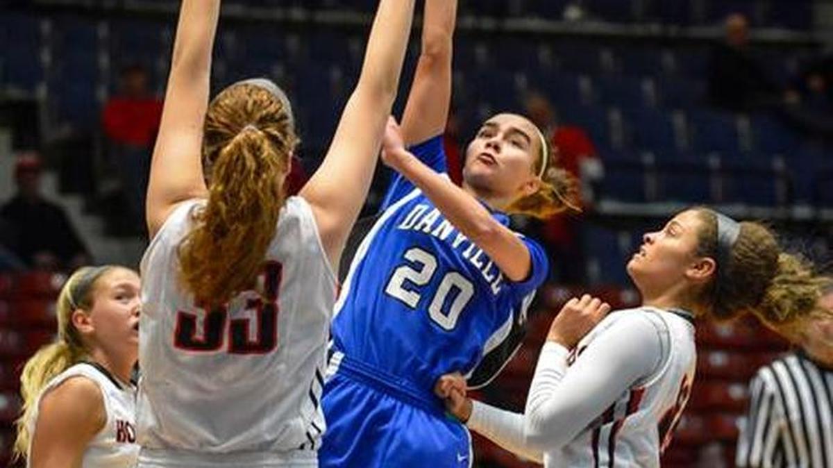 Danville's Alyvia Walker shoots over Covington Holy Cross' Ally Mayhaus, during the opening round of the girls Touchstone Energy All ‘A’ Classic, in Frankfort, Wednesday, January 28, 2015.