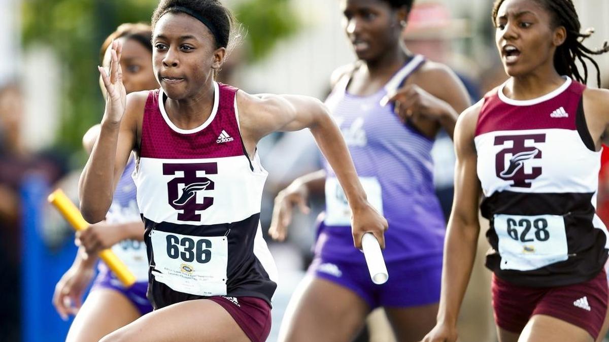 Tates Creek's Naturi Robinson (636) runs after receiving the baton from teammate Myann Davidson (628) in the girls 4x100-meter relay during the 2017 KHSAA Track & Field 3A State Meet at the University of Kentucky in Lexington, Ky., Saturday, May 20, 2017.