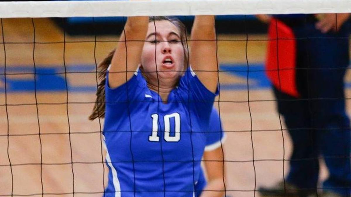 Lexington Catholic's Morgan Justice, 10, went up for a block attempts as LCA played Lexington Catholic on Tuesday September 1, 2015 in Lexington, Ky.