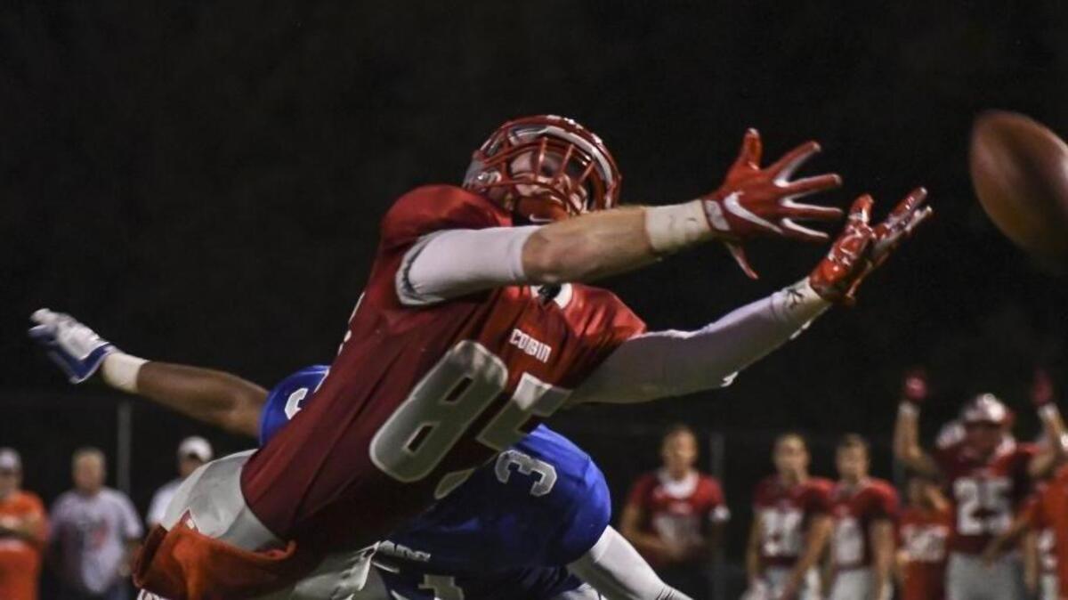 Corbin’s A.J. Moore (85) reaches for a ball in the second quarter against Danville’s David Walker (3) in the second quarter Friday, September 9, 2016., at Danville High School in Danville, KY.