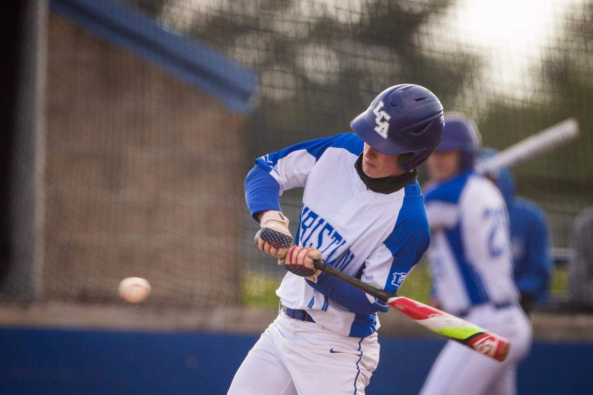 Lexington Christian’s Cole Ginter (17) swings at a pitch against Lafayette on April 21, 2021. He batted .452 with 27 RBI last season.