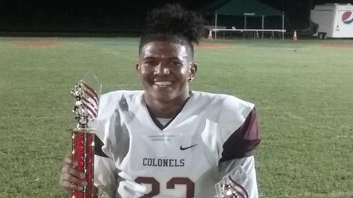 Bourbon County senior Titus Ransom posed with his MVP trophy and the team’s trophy after the Colonels defeated Somerset, 36-29, in the PBK Death Valley Bowl at Lincoln County.
