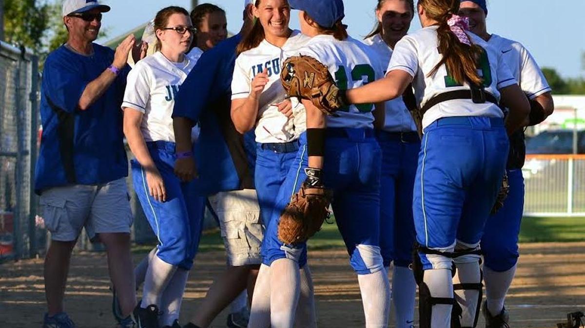 East Jessamine players and coaches surrounded Hannah James (center, smiling) after the sophomore threw a complete game in the Jaguars’ 7-4 win over East Carter in the first round of the Worth/KHSAA State Softball Tournament on June 9, 2016.