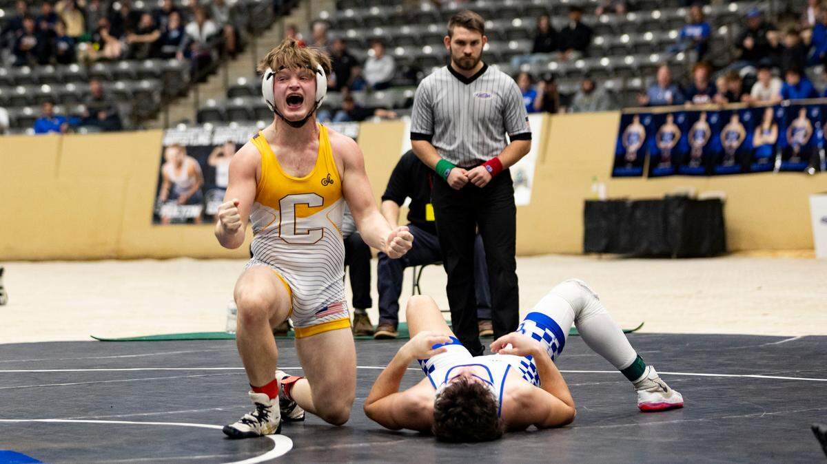 Johnson Central’s Dalton Matney celebrates after pinning Oldham County’s Miller Brown in the 165 finals Saturday.
