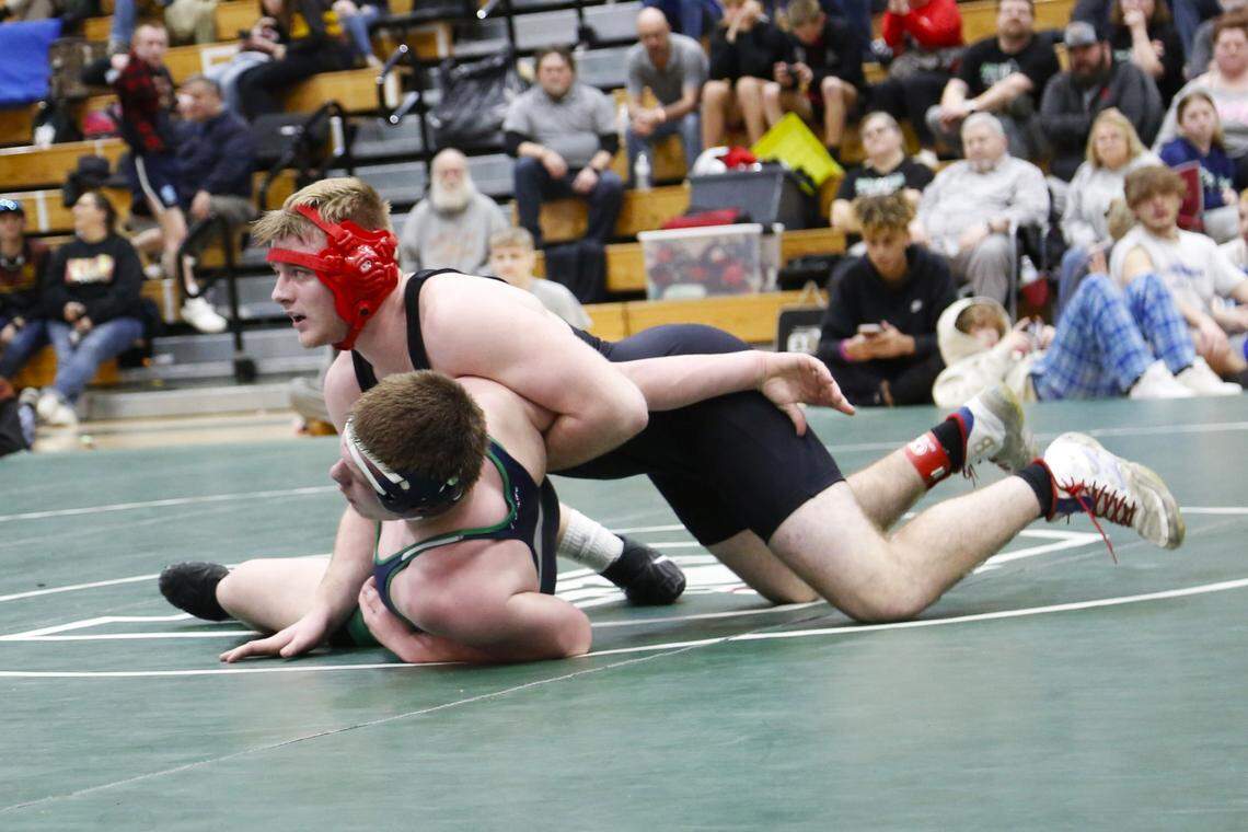 Lafayette’s Cael Green, top, tries to gain leverage on Great Crossing’s Jesse Shaddix during the 190 finals at the Region 6 Championships at Frederick Douglass High School on Saturday.