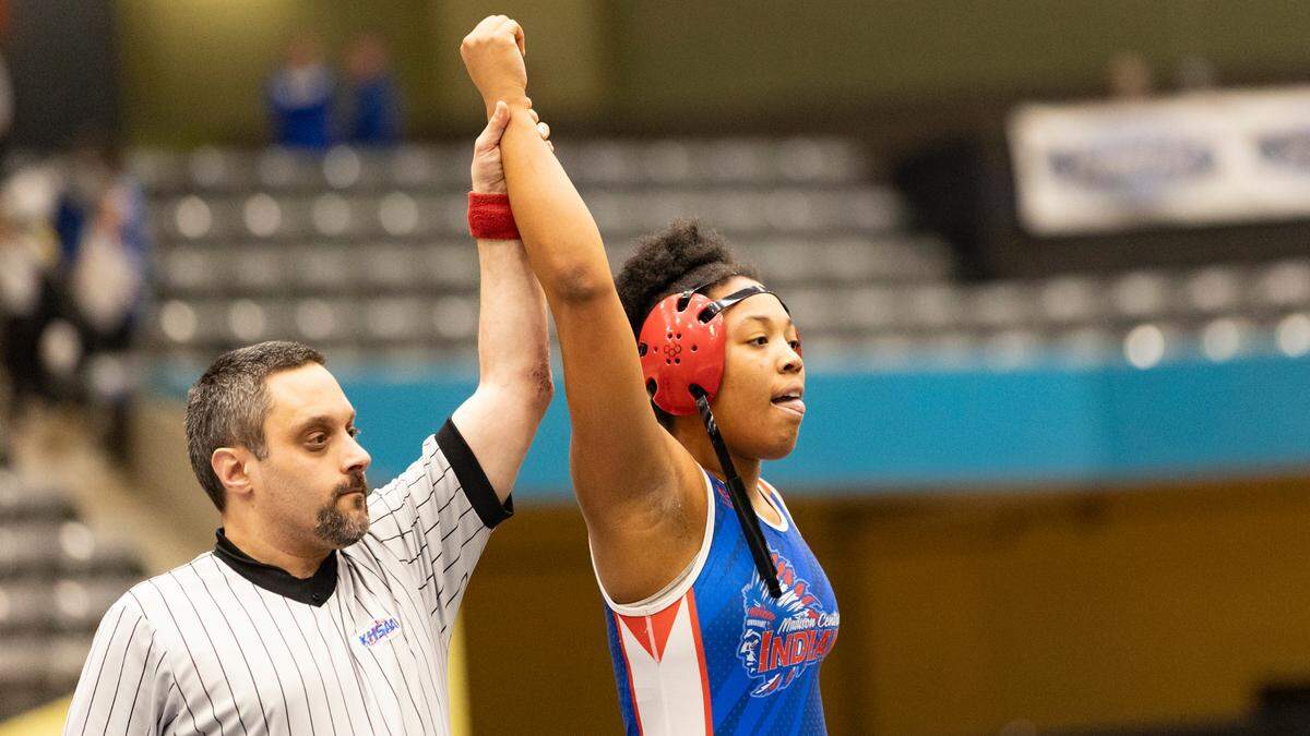 Madison Central’s Eryah Reese has her hand raised in victory after her win in the 235 finals of the 2025 KHSAA Girls State Wrestling Championships at Alltech Arena on Thursday.
