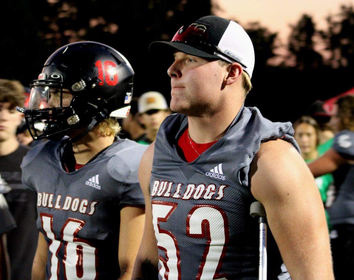 Paul Laurence Dunbar’s Ethan Hampton stood on the sidelines with his team as the Bulldogs’ hosted Collins on Sept. 1, just six days after a spinal injury suffered during their last game ended his football playing career.