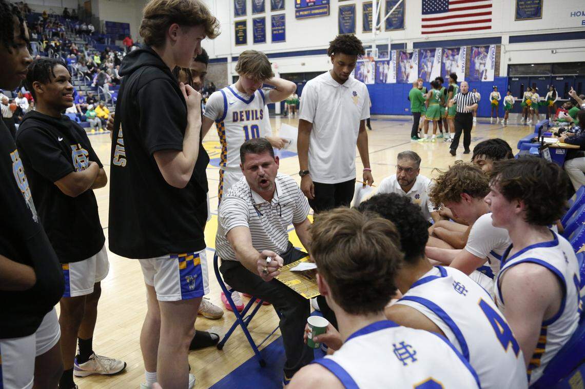 Henry Clay coach Daniel Brown delivers some instructions during a timeout in their game against Bryan Station on Friday.