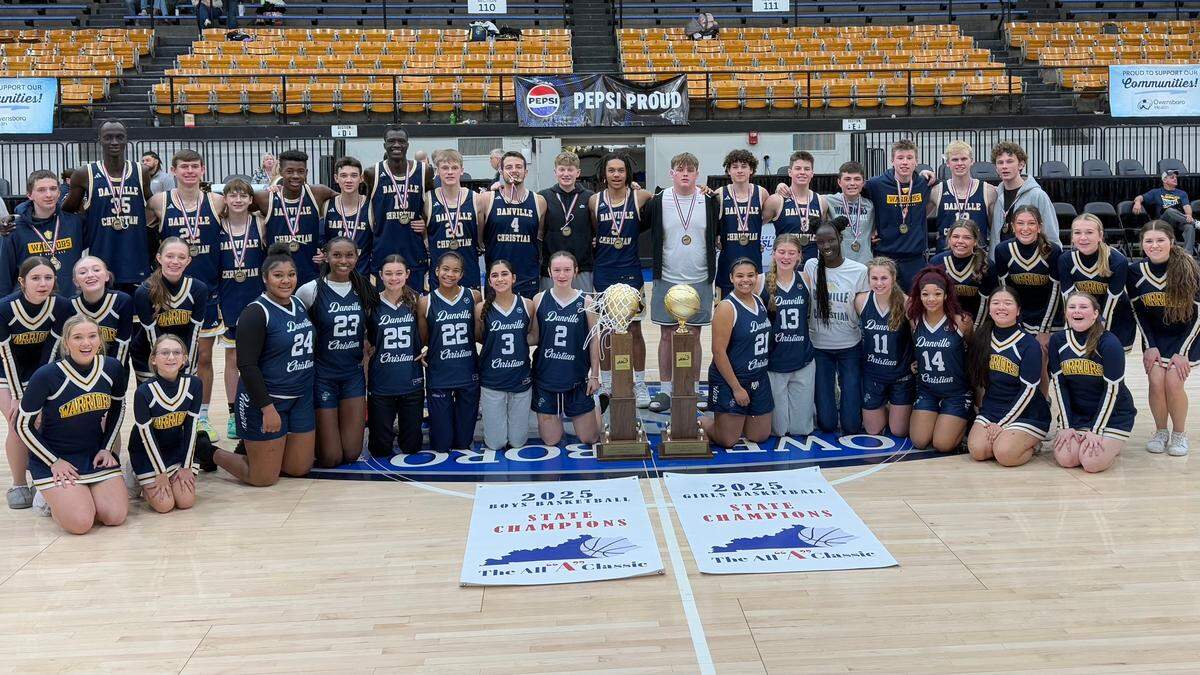 Danville Christian’s boys and girls teams and cheer squad pose with the All “A” Classic’s championship trophies after the Warriors’ historic sweep of the small-school tournaments at Owensboro Sportscenter on Sunday.