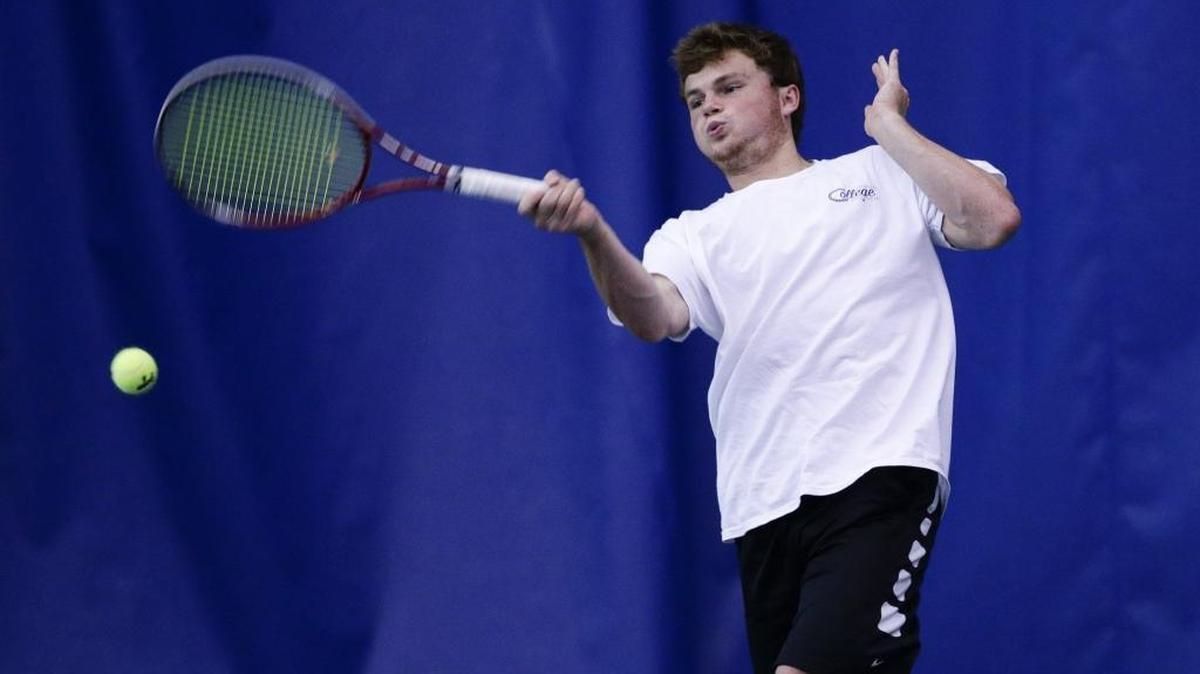 Dunbar's Bryce Shelton returned a serve during the 11th region tennis finals on Thursday May 12, 2016 in Lexington, Ky.