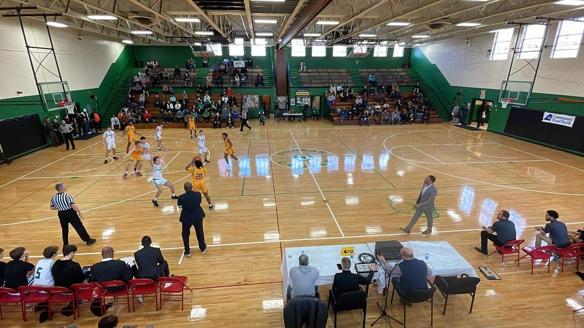 Paul Laurence Dunbar’s boys’ basketball team, wearing its throwback Bearcats green and white uniforms, hosted the Central Yellow Jackets at Dunbar Community Center’s gymnasium on Saturday. The gym was once part of Lexington’s original segregation-era Dunbar High School.