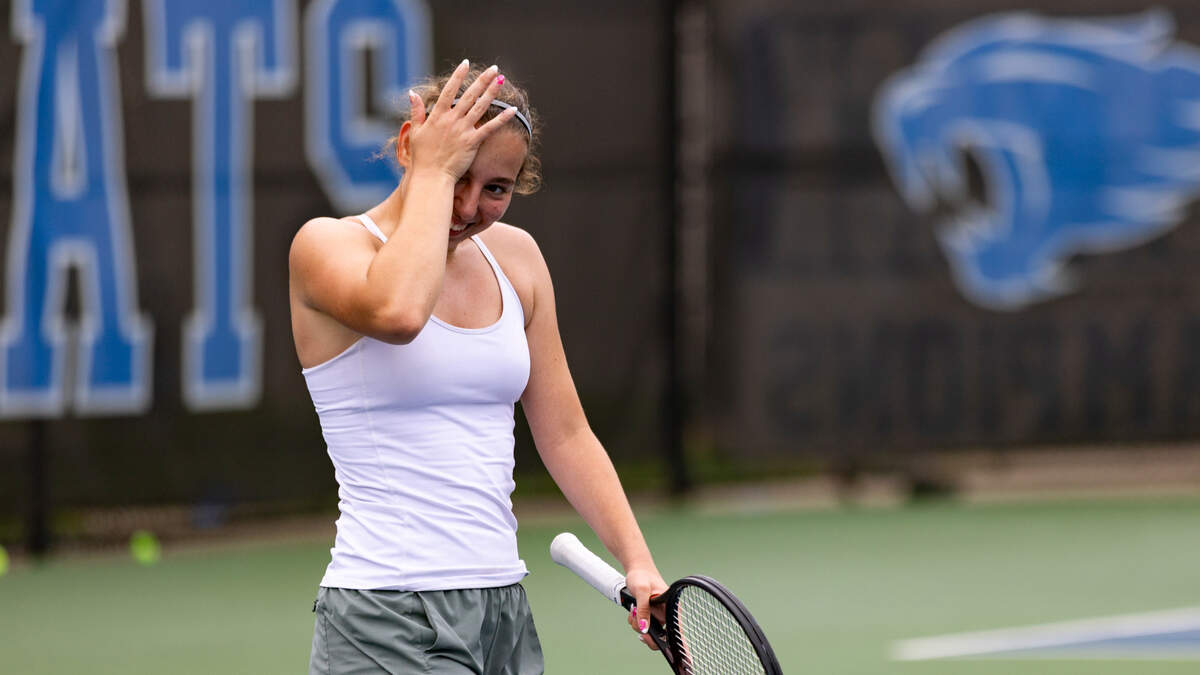 Scott County’s Sydney Zakic smiles at her supporters after her 6-4, 6-1 win in the 2025 KHSAA Girls State Tennis Tournament singles championship match at the University of Kentucky’s Hilary J. Boone Tennis Complex on Thursday.