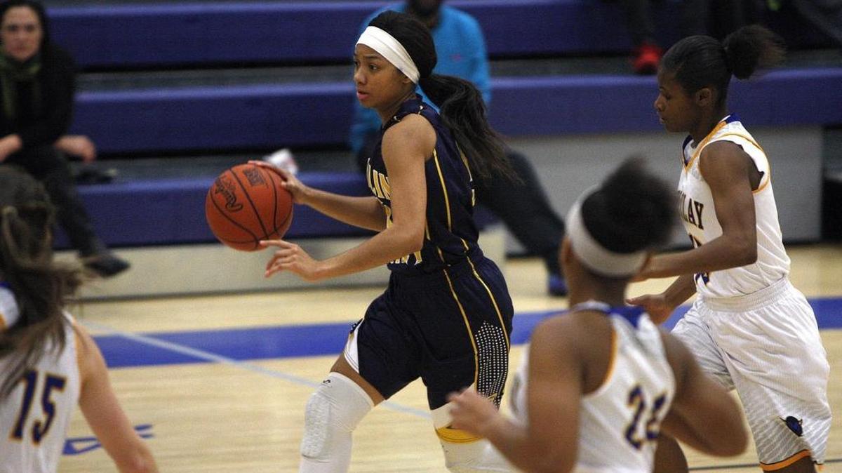Franklin County's Princess Stewart dribbles on the fast break in a winning effort against 11th region rival Henry Clay in the Al Prewitt Gymnasium in Lexington, Ky., Thursday, January 7, 2016.