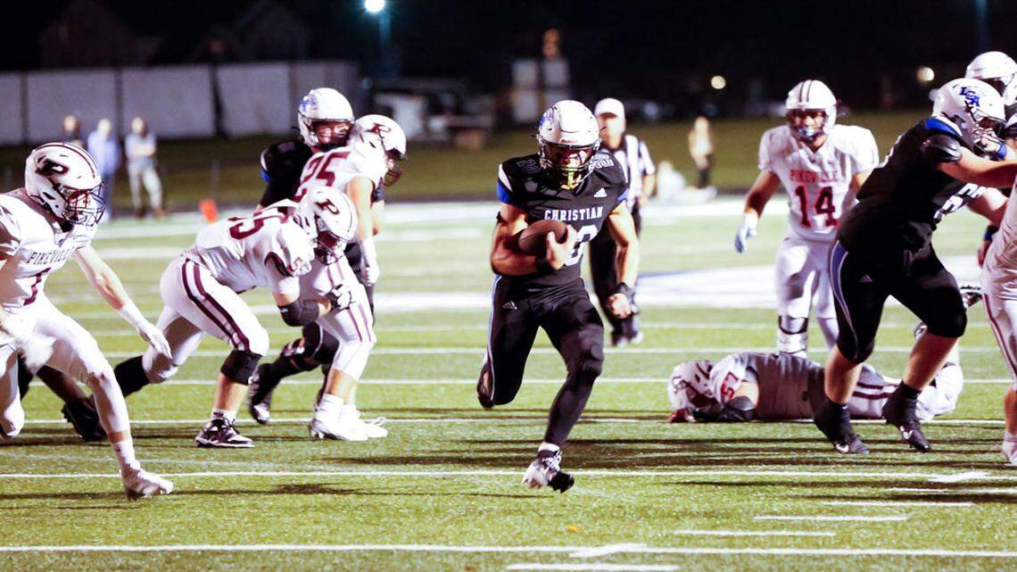 Lexington Christian’s Leland Edwards, center, runs for a 20-yard touchdown in the second half of the Eagles’ 40-26 win over Pikeville in the eCampus.com Bowl at Lexington Christian Academy on Friday.