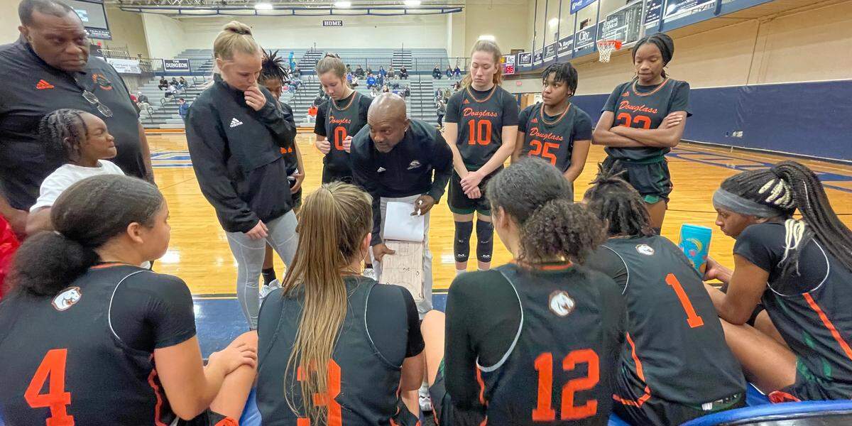 Frederick Douglass Coach Daryl Moberly went over some defensive strategy with his team during a timeout as the Broncos played Lexington Catholic in the White, Greer & Maggard Holiday Classic.