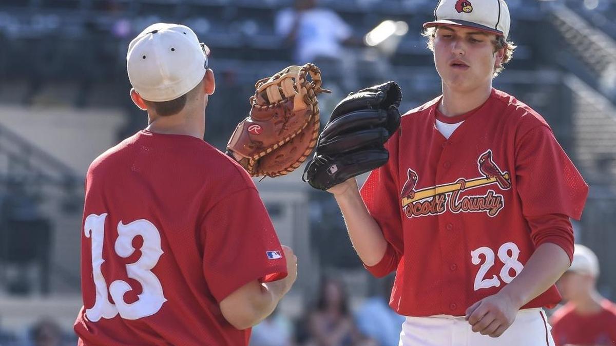 Scott County’s Trey Ogle (13) congratulates Scott County Jordan Fox (28) after getting out of the second inning against Caldwell County at Whitaker Bank Ballpark during 2016 Rawlings/KHSAA State Baseball Tournament on Friday June 10, 2016., in Lexington, KY.