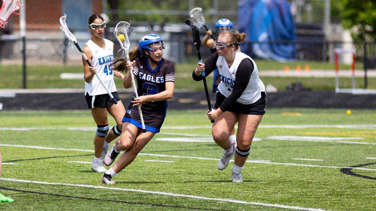 Lexington Christian’s Sarah Biliter, left, tries to work around the defense of Lexington Catholic’s Emma Stanley.