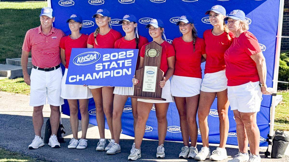 The Madison Central girls golf team celebrates its championship Wednesday at the Leachman Buick-GMC-Cadillac/KHSAA Girls State Golf Championship. The Indians shot a collective 28-over 604 in the event, setting a tournament record. From left are assistant coaches Brandon Fritz and Holly Knecht, players Haley Federspiel, Aubrey Barrow, Mollie Neeley, Rosie Patterson, Mackenzie Federspiel and head coach Tennye Ohr.
