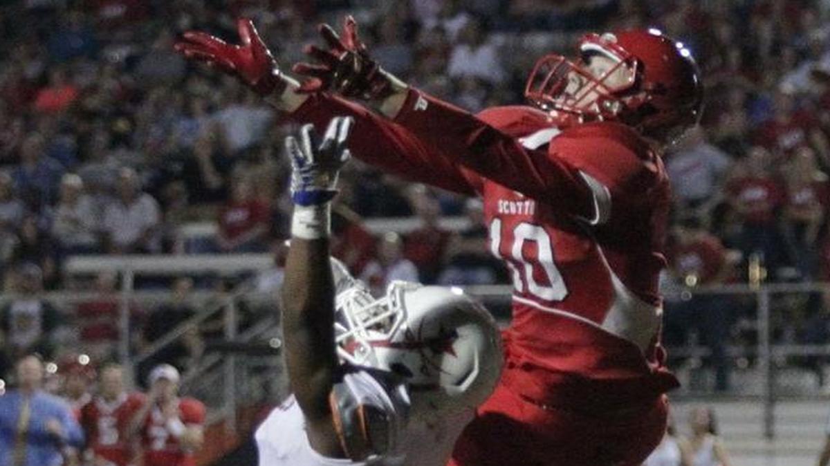 Cooper Robb reached over Javarius Robinson for an interception for Scott County. Scott County hosted Lafayette High School on September 16, 2016.