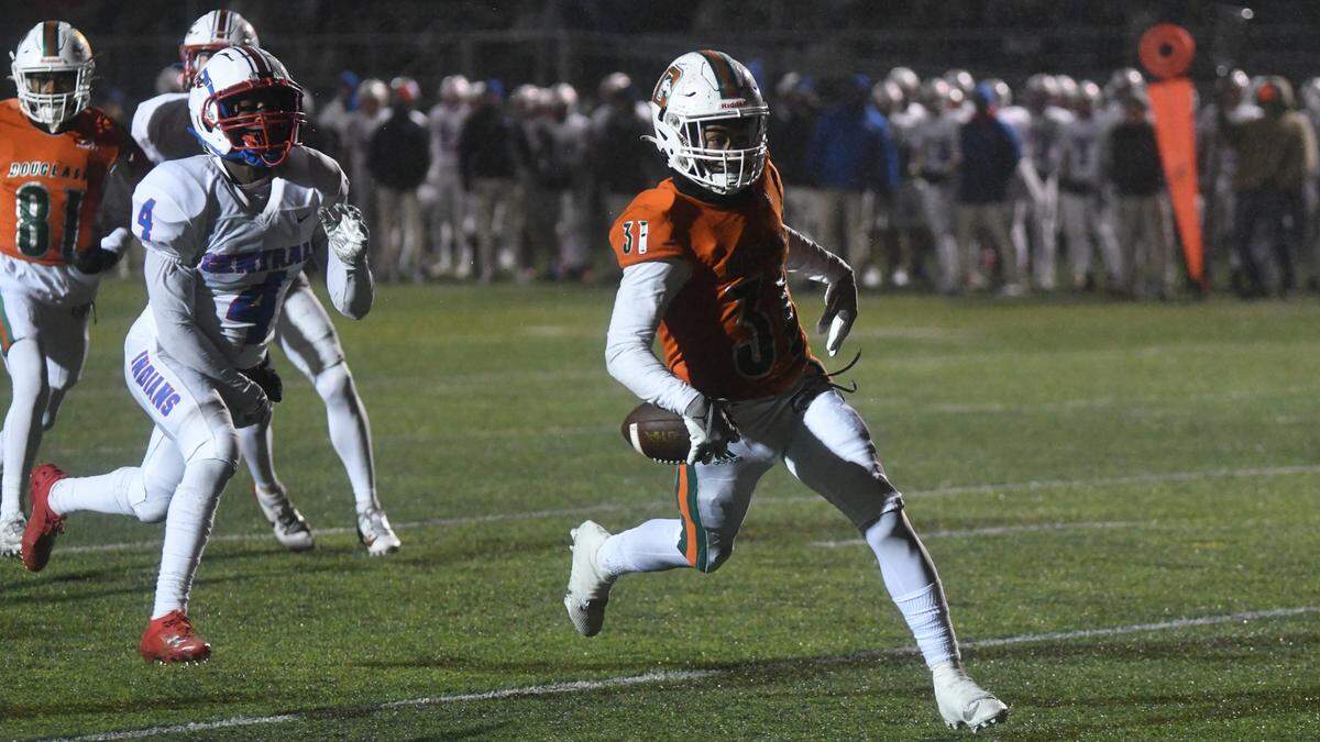 Frederick Douglass running back Dakari Talbert scores against Madison Central in the Broncos’ 36-6 win against Madison Central in their region championship game at The Farm on Friday.