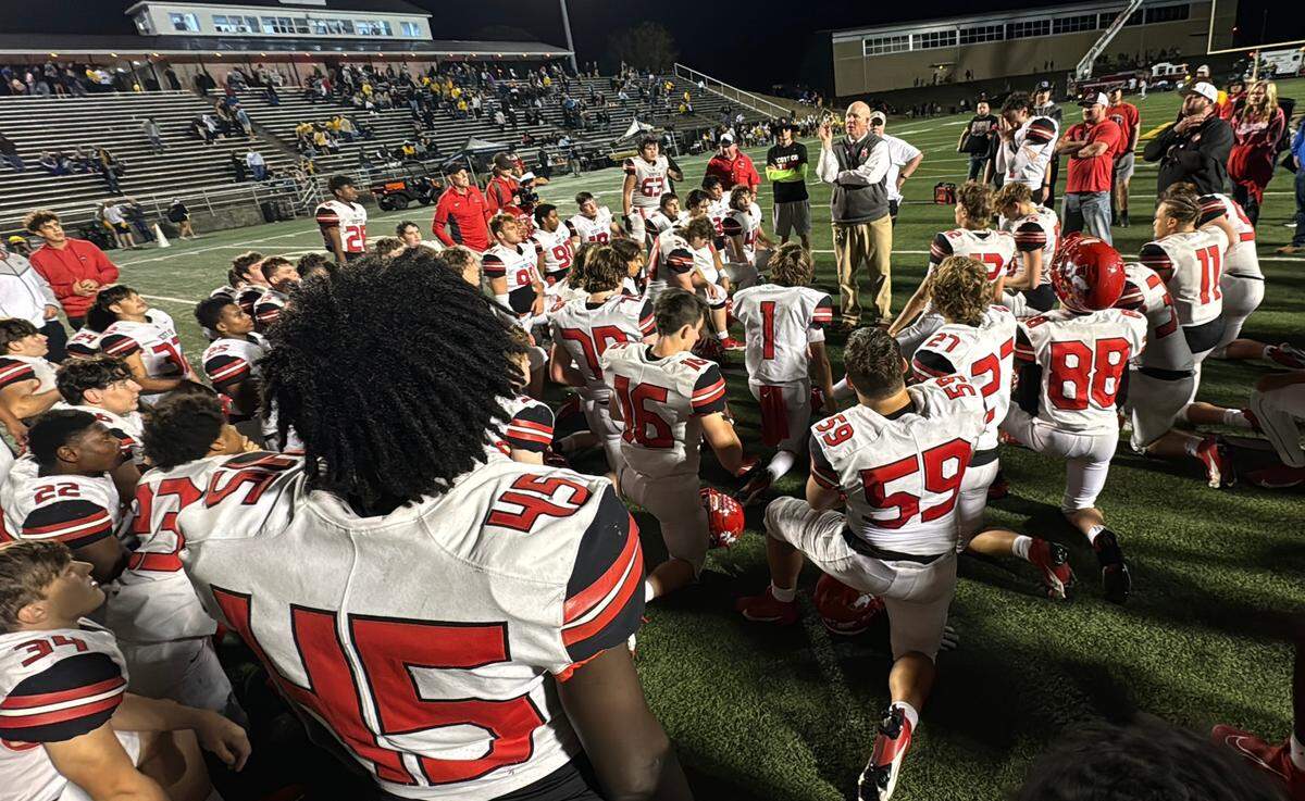 Scott County coach Jim McKee spoke to his team after the Cardinals’ 36-0 win over Woodford County at Community Stadium in Versailles on Friday.
