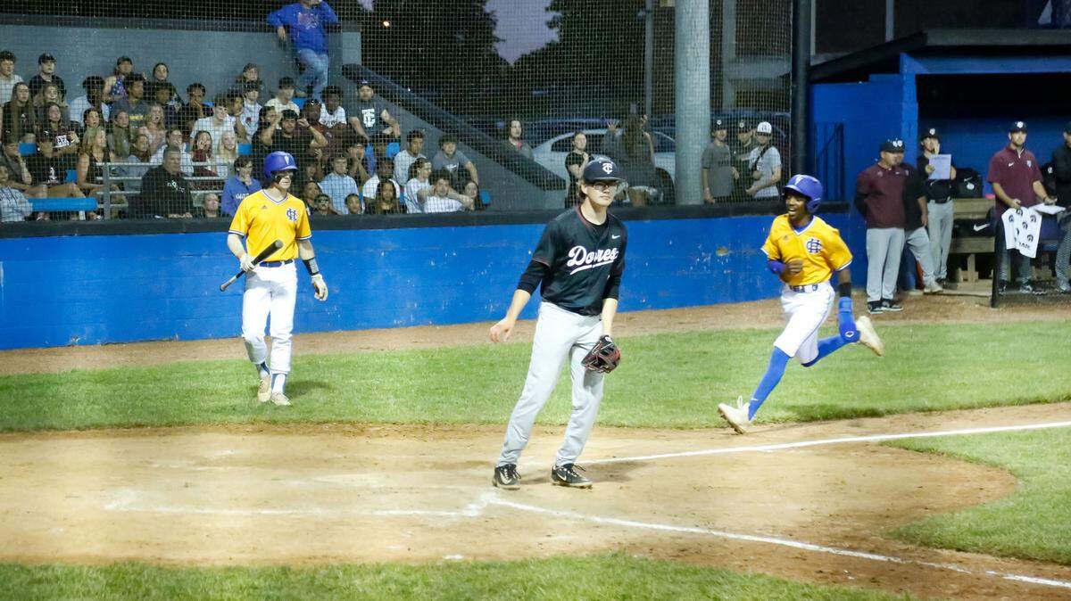 Henry Clay’s Nore Day, right, scores on a wild pitch by Tates Creek’s Carson van Haaren, center, during the at-bat of Walden Cole. The run gave the Blue Devils a 3-0 lead in the bottom of the fifth inning.