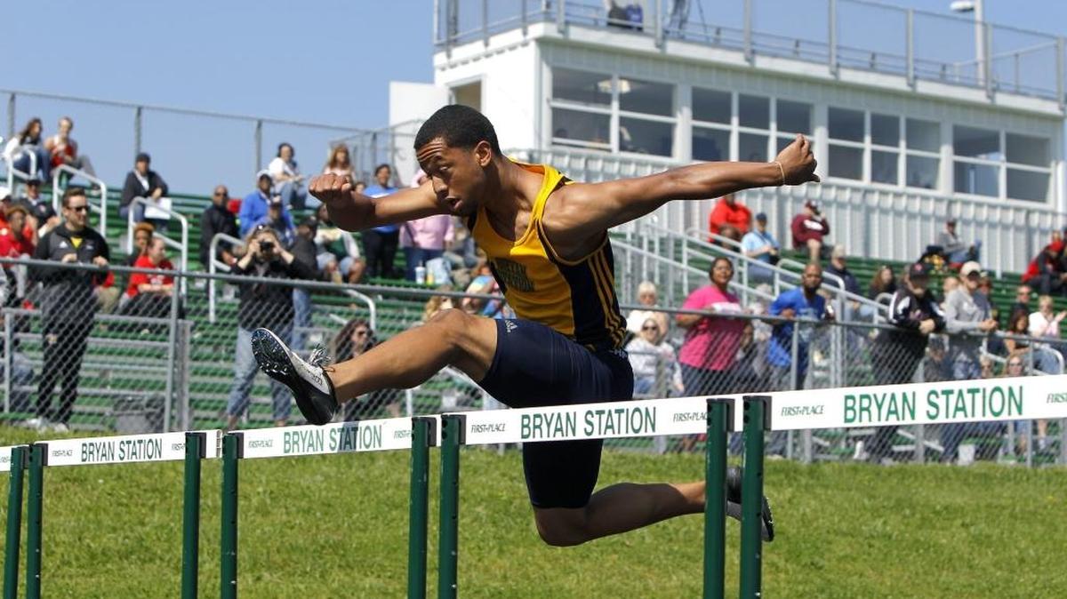 Bryan Station's Isaiah McCall clears a fence while winning the 110m hurdle at the region 6 track tournament for Class 3A at R. L. Grider Stadium at Bryan Station high school in Lexington, Ky., Saturday, May 13, 2017.