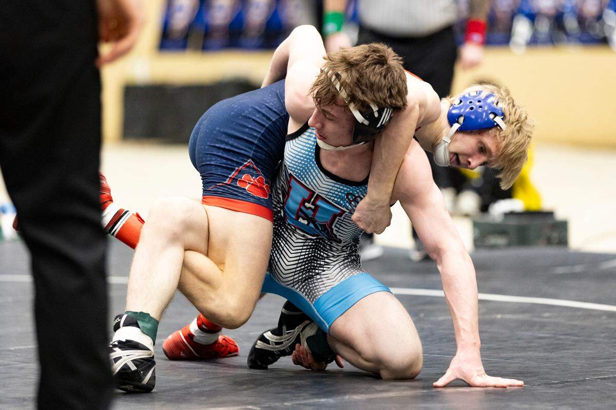 Anderson County’s Corban Nance, at back, tries to leverage Union County’s Brennen Clifford to the mat during the 126 class finals Saturday.