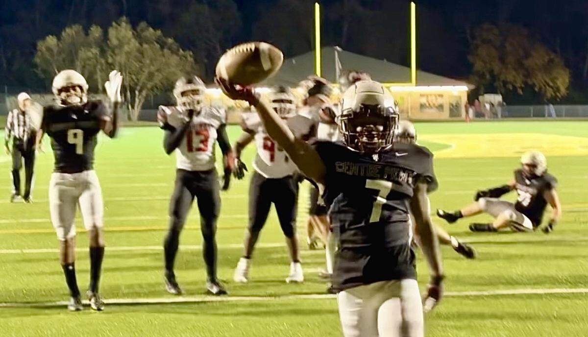 Tates Creek’s MarQuevion Smith ran through a wide gap created by his offensive line for a short score in the second half against George Rogers Clark at Bryan Station High School on Thursday night. Smith rushed for 107 yards and scored two second-half TDs.