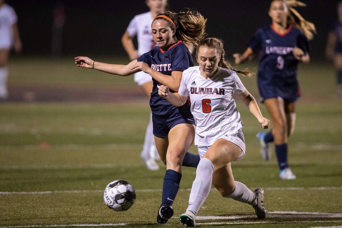 Paul Laurence Dunbar’s Riley Heasley (6) fends off a Lafayette player during last year’s 43rd District semifinals. Heasley is one of Dunbar’s leaders as a senior this season.